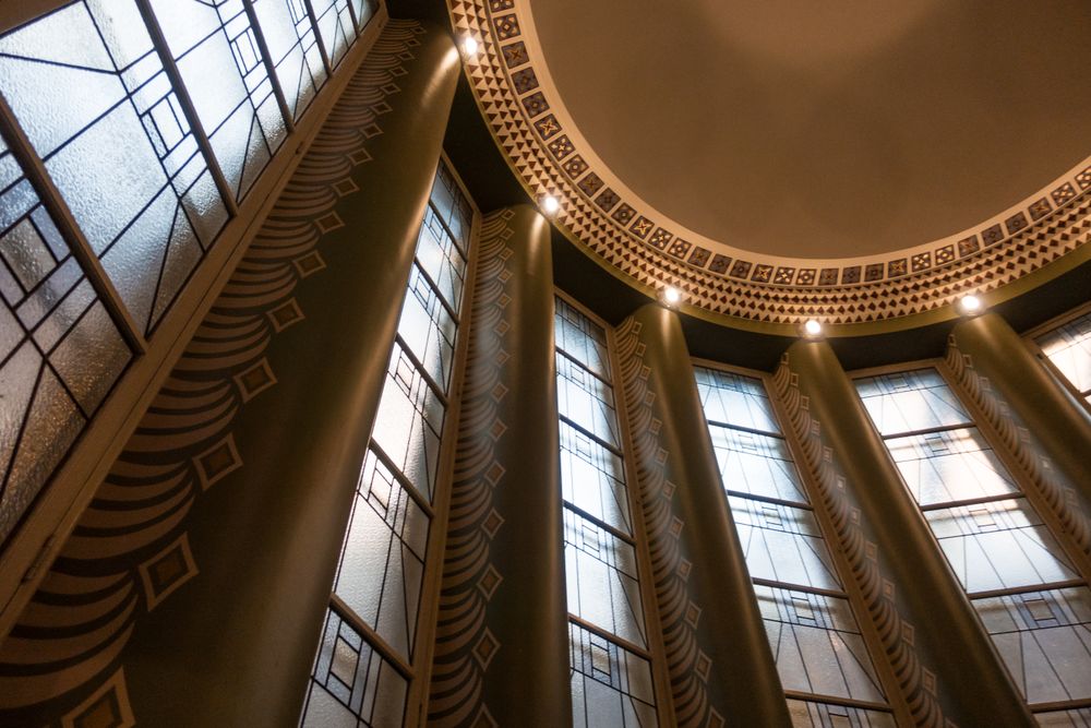 Art deco colonnade rising to a domed ceiling.